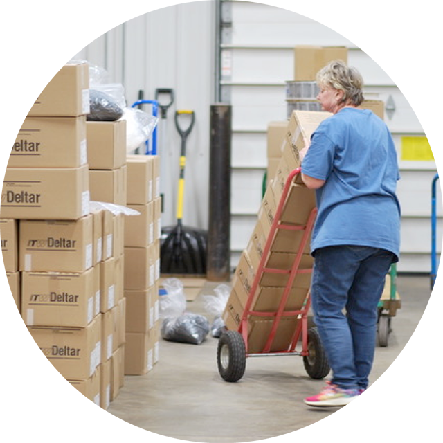 Woman transporting packages at PQS